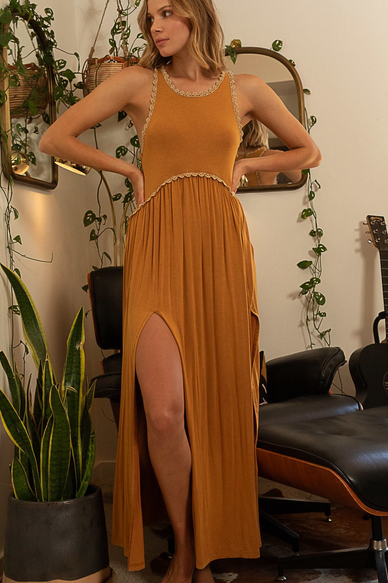 RARA Boutique baby doll maxi dress with side slit and cut-out details, featuring a stylish and flowy design for elegant occasions.