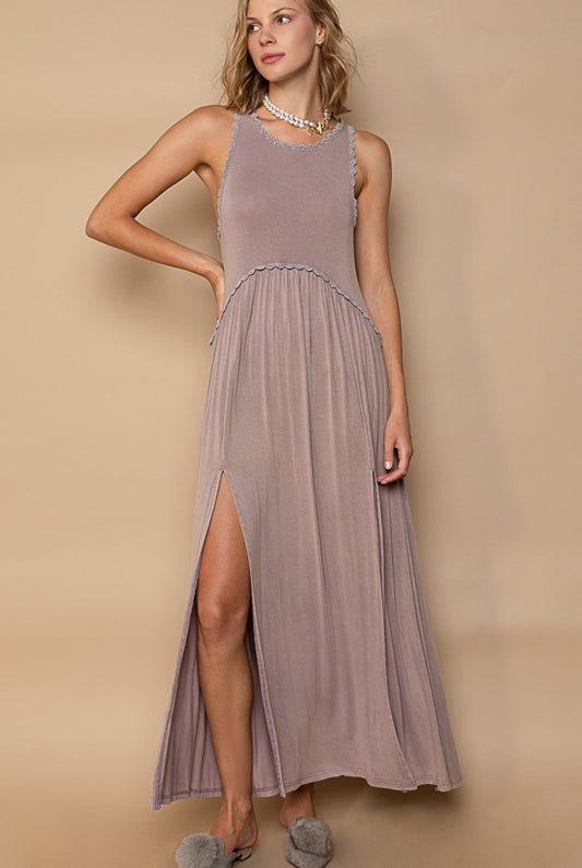 RARA Boutique baby doll side slit cut out maxi dress in soft fabric, featuring a flowing silhouette and stylish cut-outs.