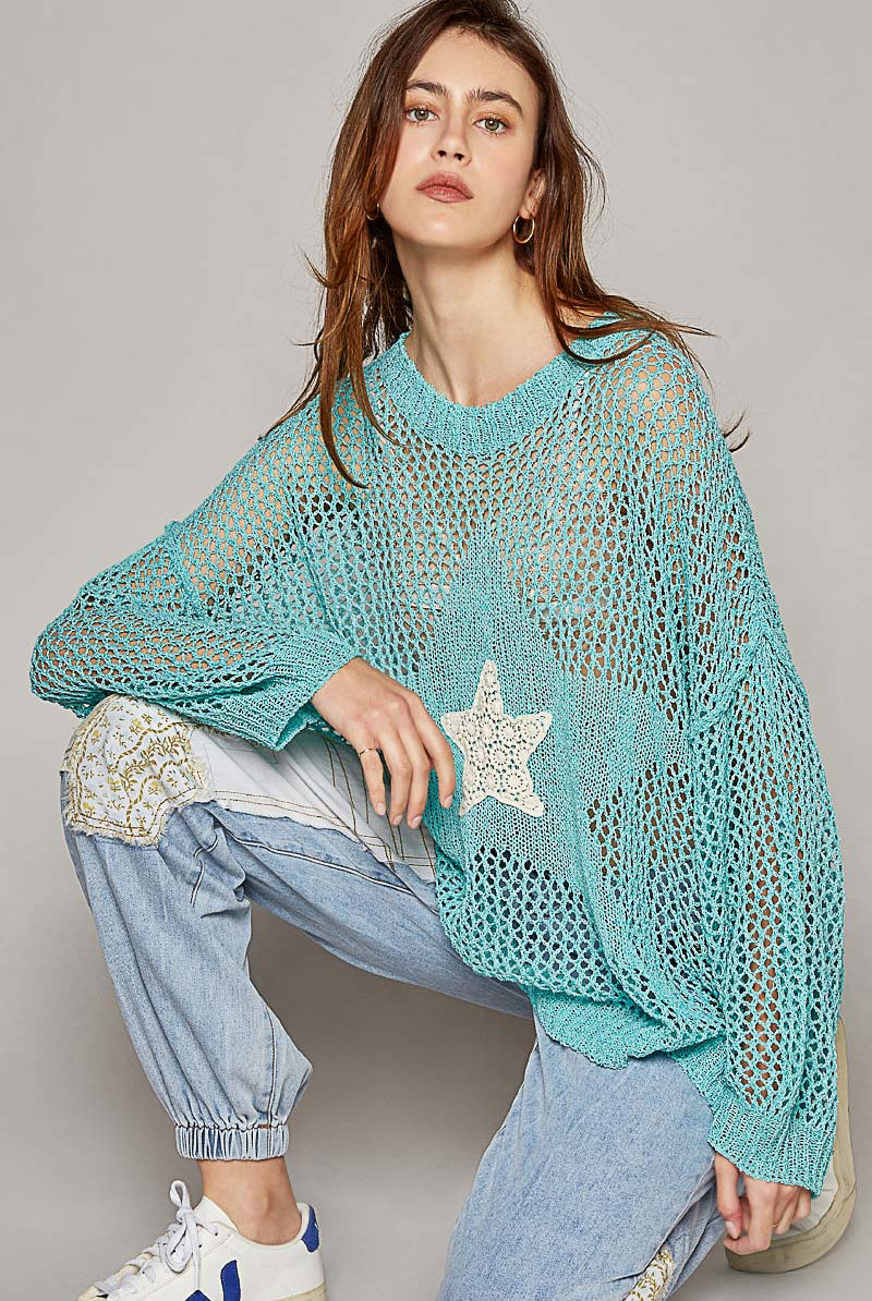 Oversized crochet star sweater by RARA Boutique featuring a cozy knit design and star pattern in a relaxed fit.