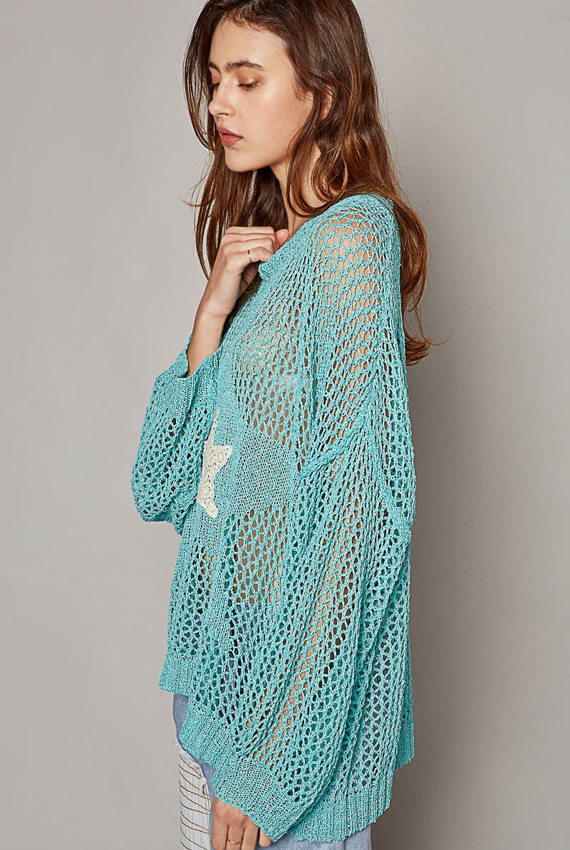 RARA Boutique oversized crochet star sweater in cozy knit, featuring a large star design on the front.
