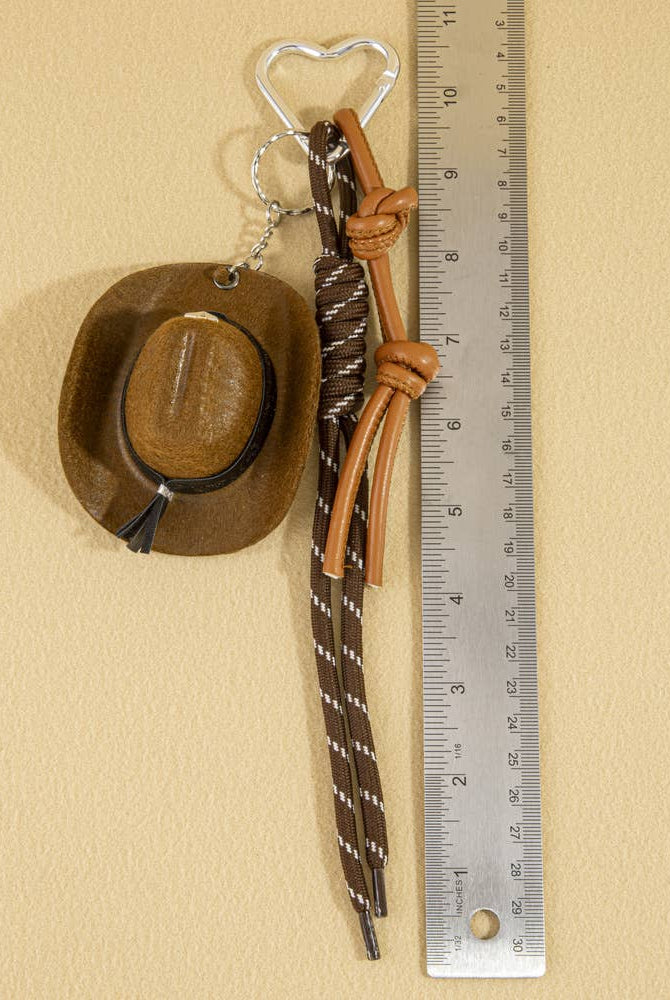 Mini cowboy hat with western rope detail, charm accessory from Collections by Fame Accessories, perfect for bags or keychains.