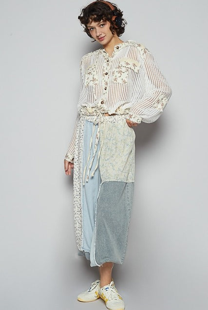 RARA Boutique floral patch open knit crochet hoodie jacket with colorful floral embroidery and relaxed fit.