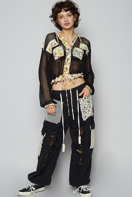 RARA Boutique floral patch open knit crochet hoodie jacket with colorful floral embroidery and relaxed fit.