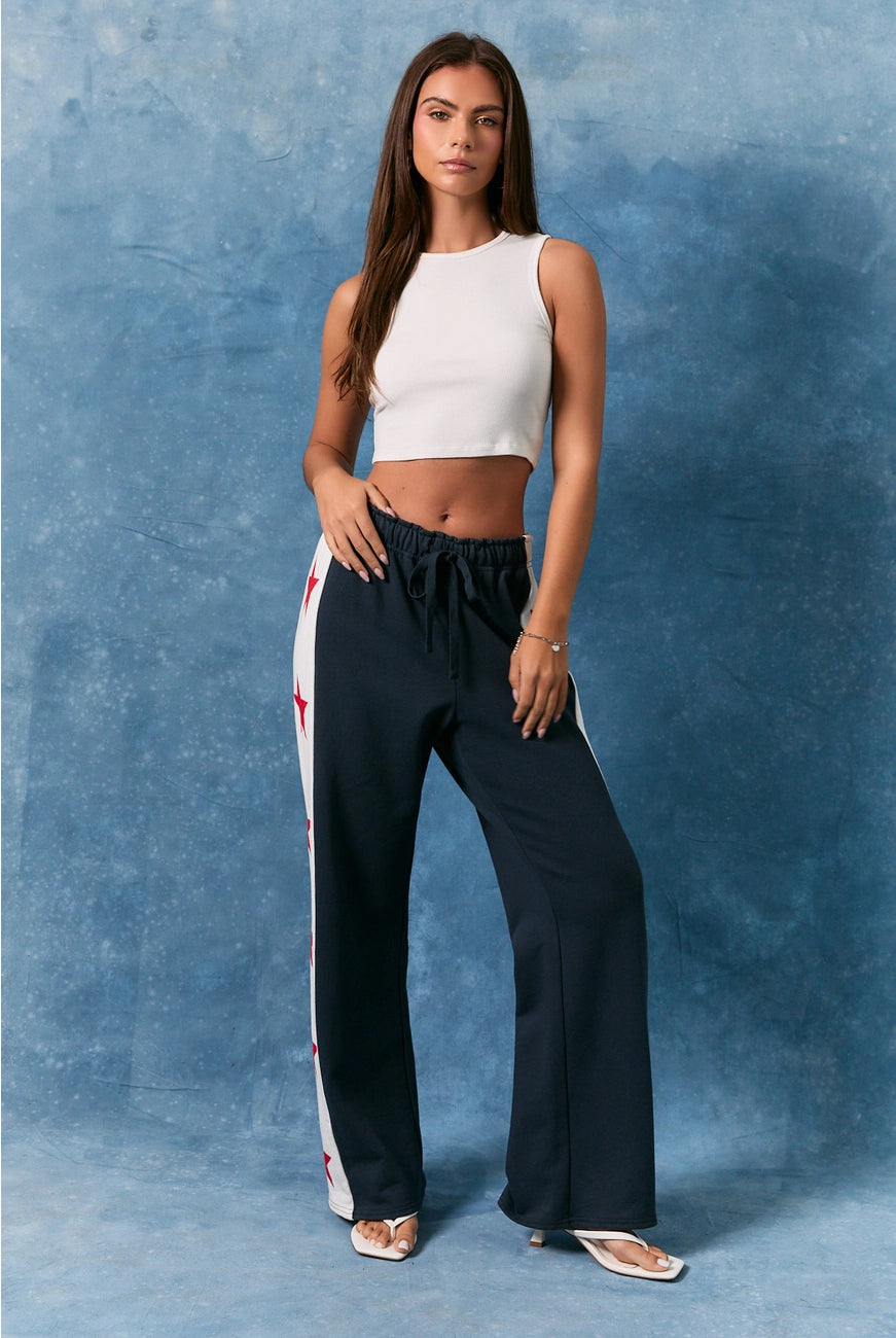 RARA Boutique Star Side Stripe Wide Leg Baggy Sweatpants with relaxed fit, featuring star accents and side stripe design.