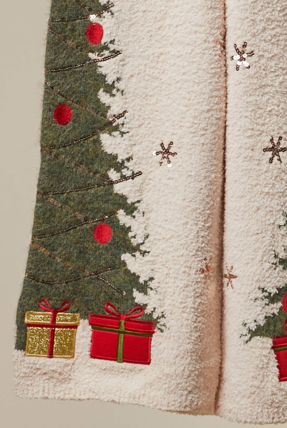 Mello Christmas tree sweater pants featuring festive holiday patterns and cozy knit fabric, designed for seasonal comfort.