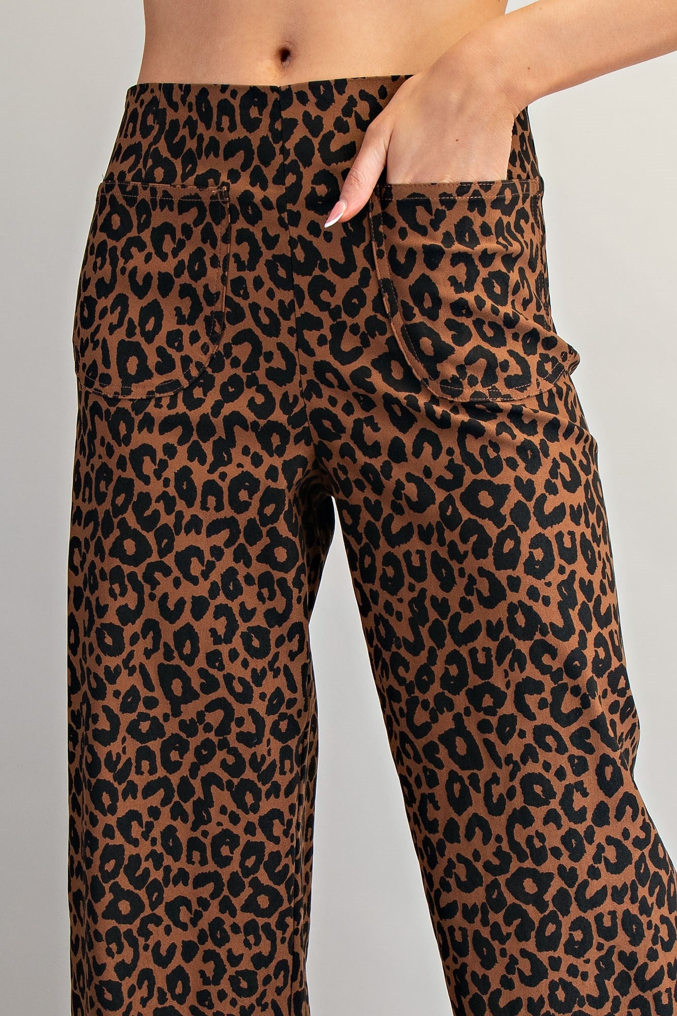 RARA Boutique DELETE Leopard Ruffle Hem Cropped Pants with animal print and ruffled hem, stylish cropped pants for a trendy look.