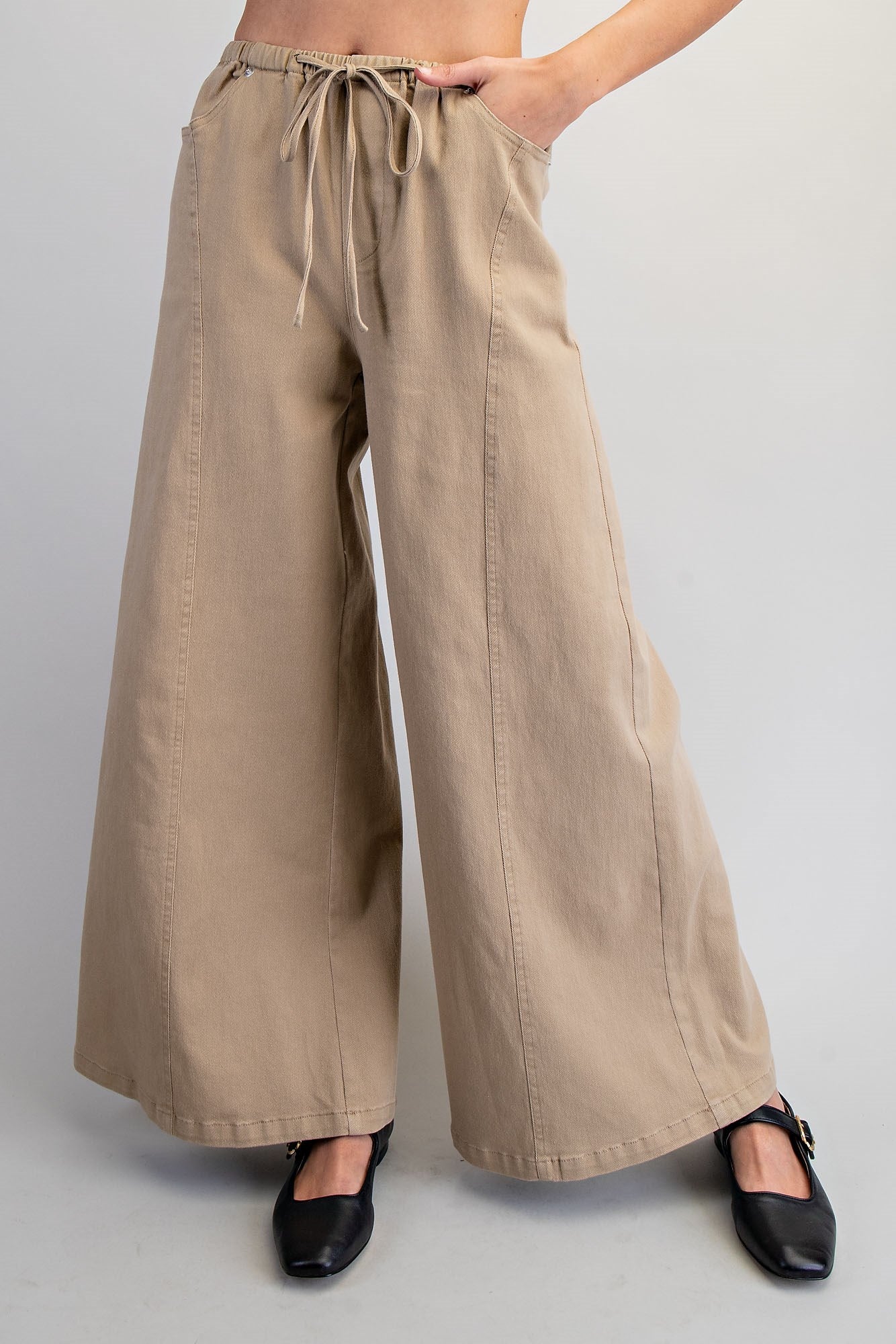 RARA Boutique wide leg slouchy denim pants with drawstring waist, relaxed fit and casual style, shown in natural fabric detail.