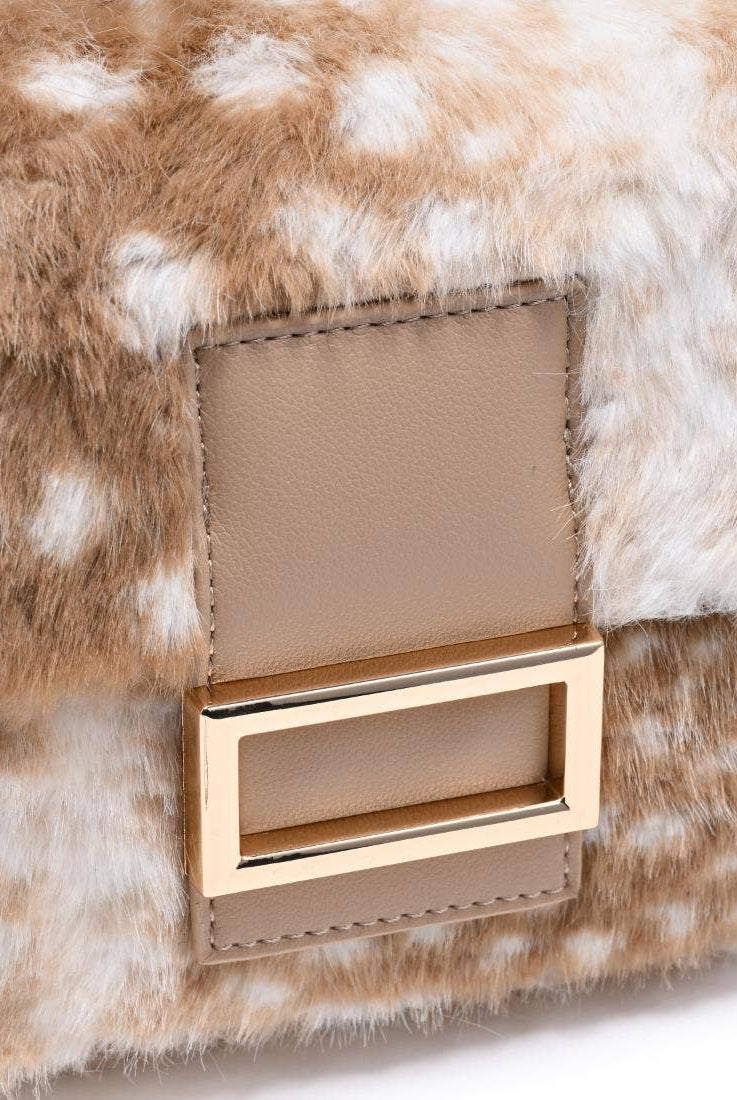 Urban Expressions Tuesday Beverly deer print fur crossbody bag with adjustable strap and zippered closure.