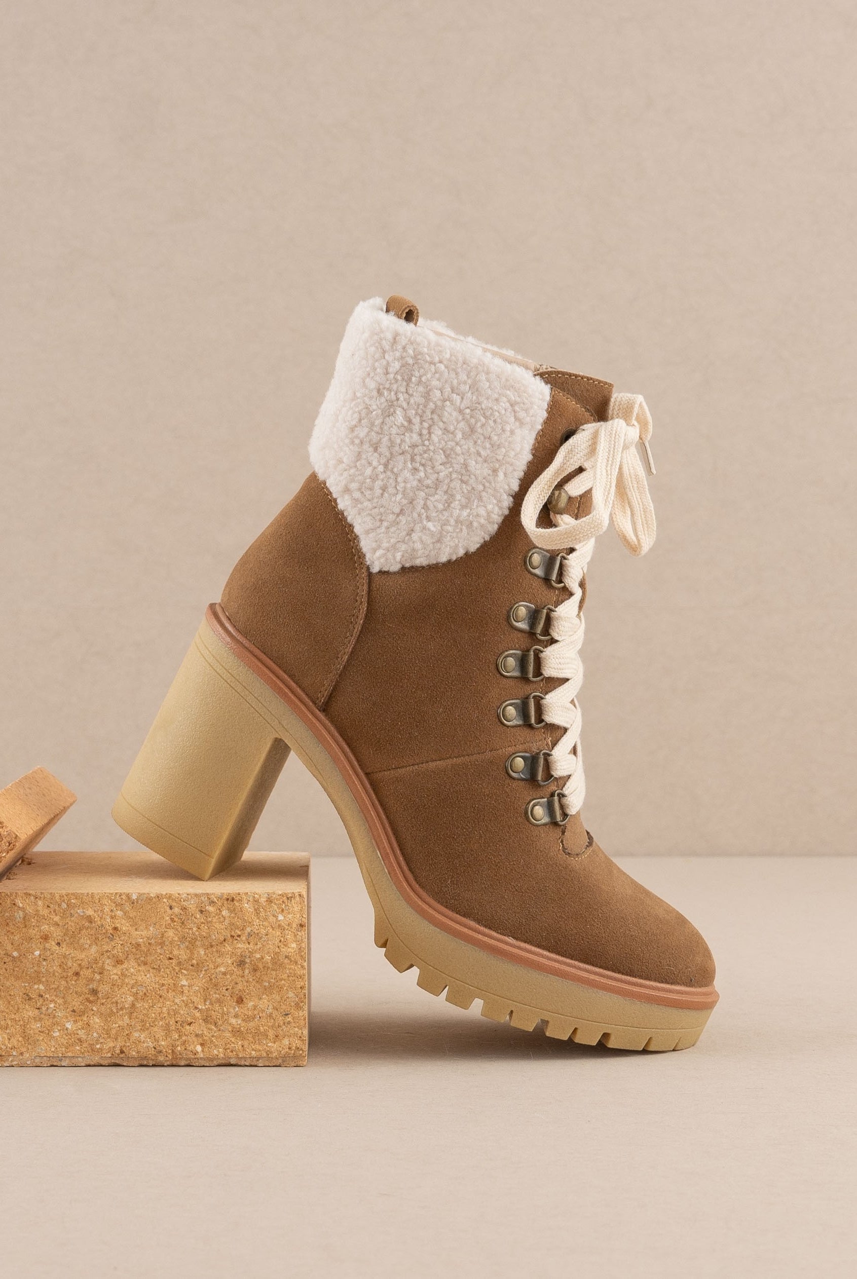 RARA Boutique heeled platform lace-up sherpa boots with chunky soles and cozy faux fur lining, stylish for winter wear.