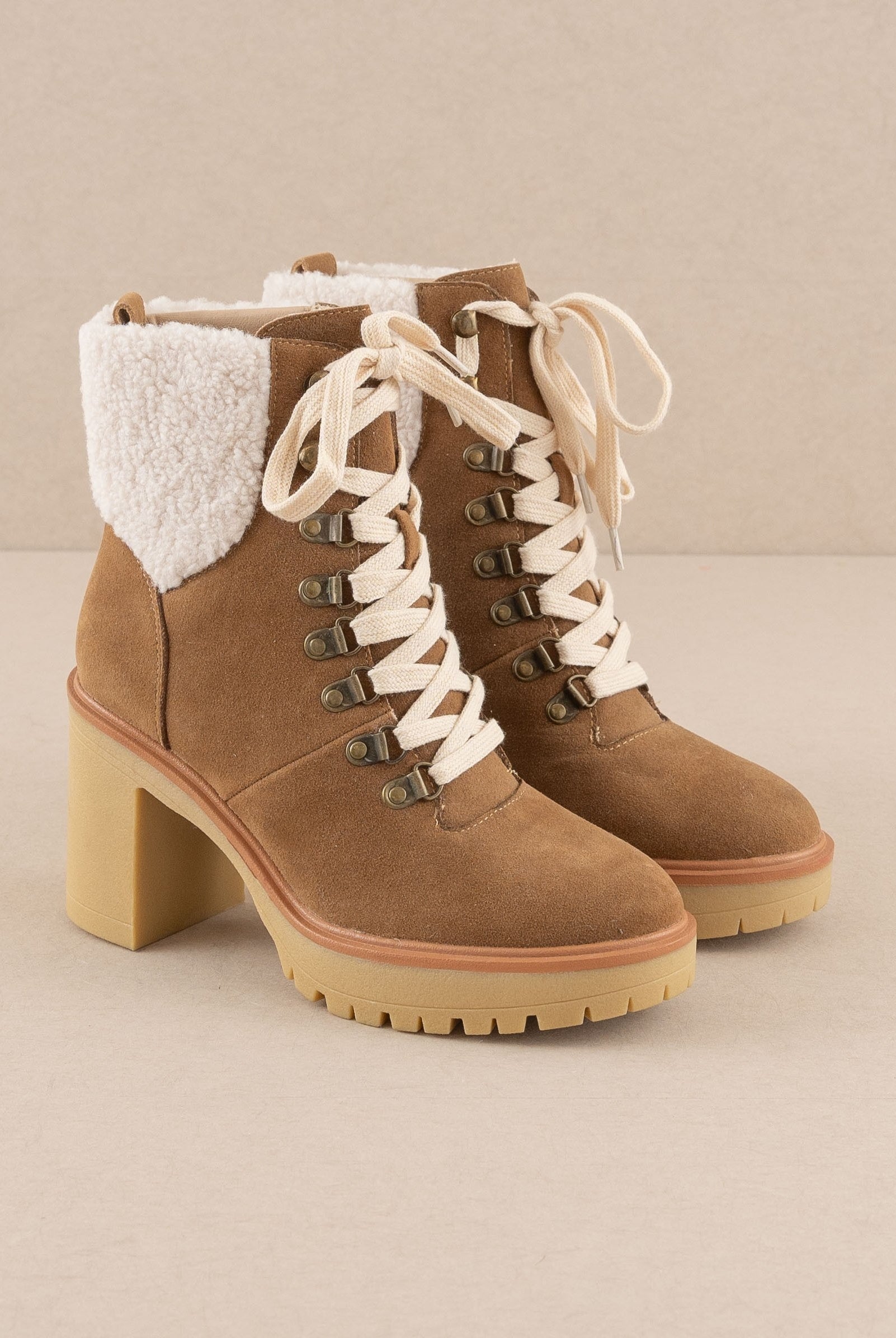 RARA Boutique heeled platform lace-up Sherpa boots with chunky sole and cozy fleece lining, stylish for winter wear.