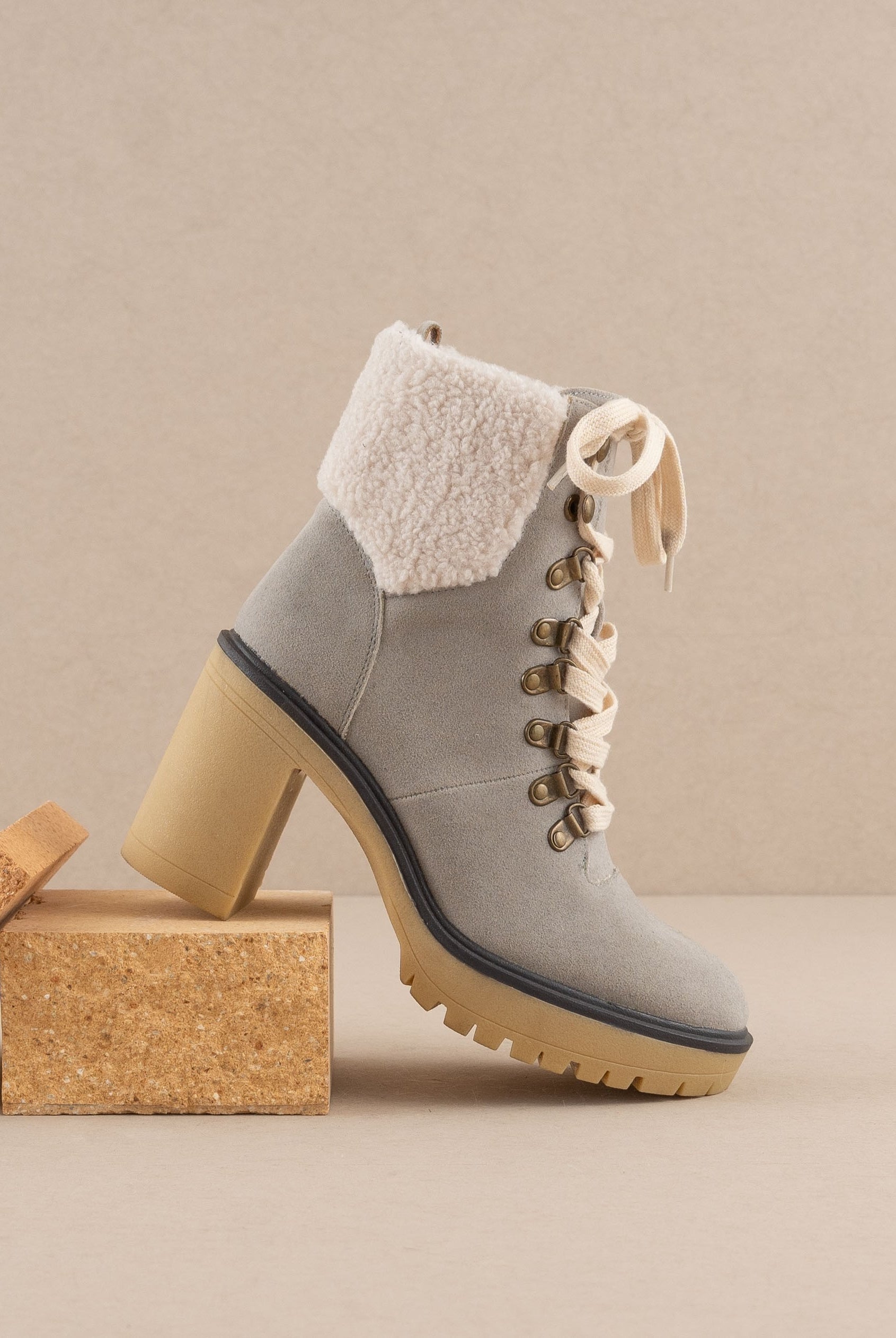 RARA Boutique heeled platform lace-up sherpa boots with chunky soles and cozy fur lining, stylish for cold weather.