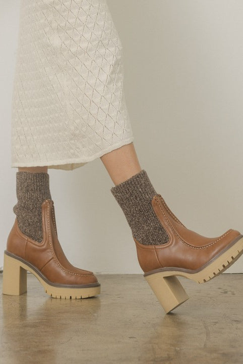RARA Boutique heeled platform sweater sock boots featuring a chunky heel and cozy knit design, stylish for fall and winter wear.