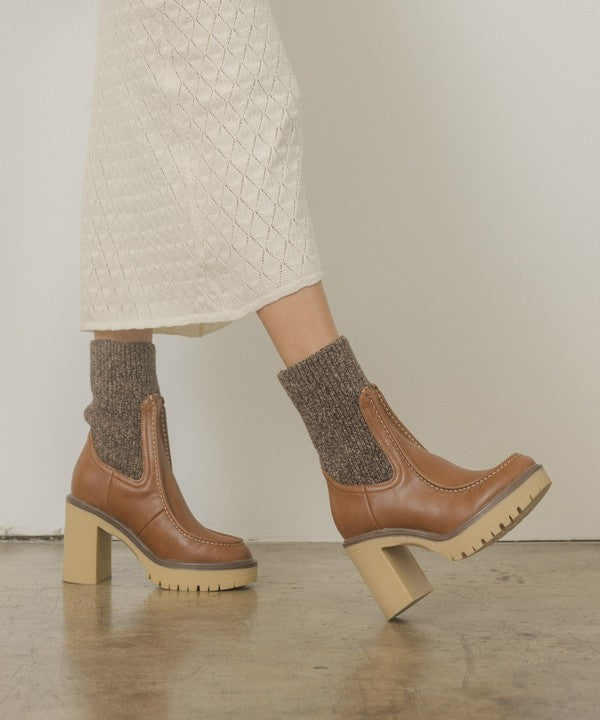 RARA Boutique heeled platform sweater sock boots featuring a chunky heel and cozy knit design, stylish for fall and winter wear.