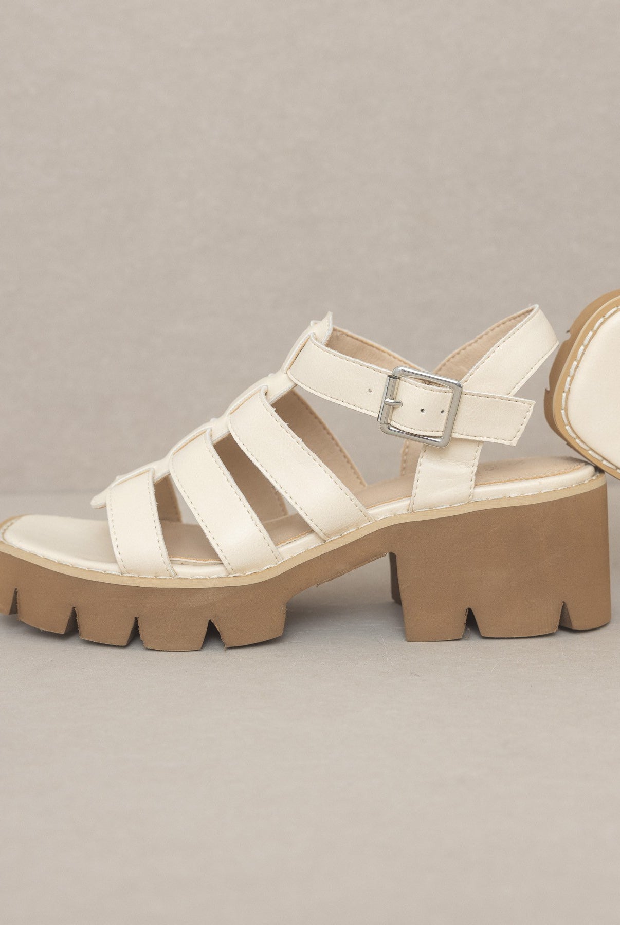 RARA Boutique Lug Sole Heeled Gladiator Sandals with straps and open toe design, featuring a chunky lug sole and ankle buckle.