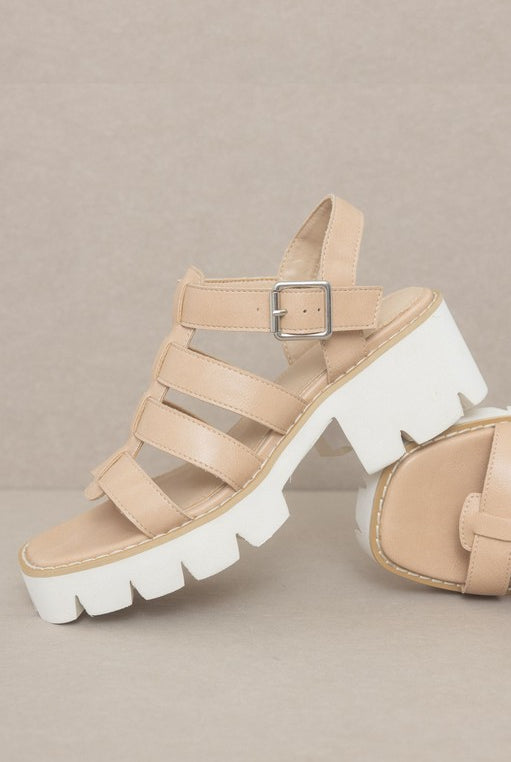 RARA Boutique Lug Sole Heeled Gladiator Sandals with multiple straps and ankle buckle, stylish open-toe design.