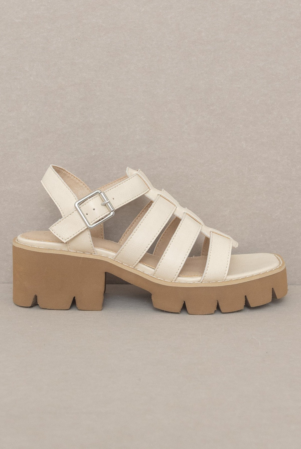 RARA Boutique Lug Sole Heeled Gladiator Sandals with straps and open toe design, featuring a chunky heel and ankle buckle.