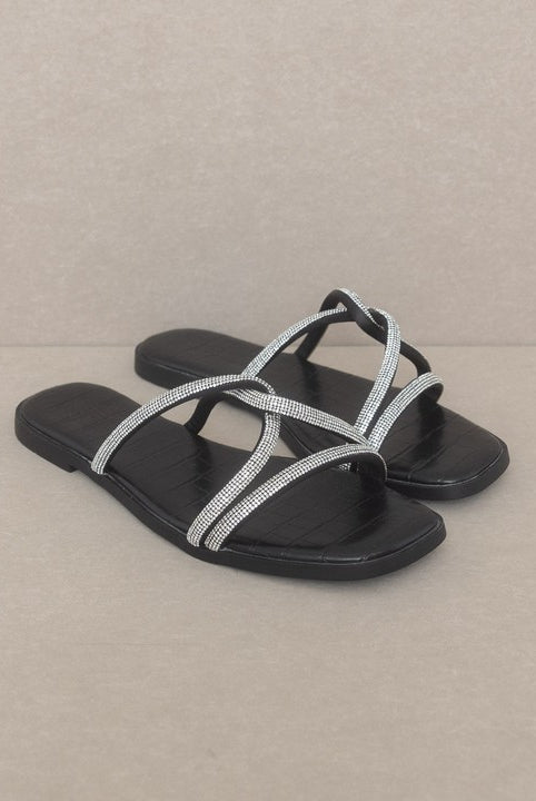 RARA Boutique strappy rhinestone sandals with intricate straps and sparkling embellishments, perfect for stylish summer wear.