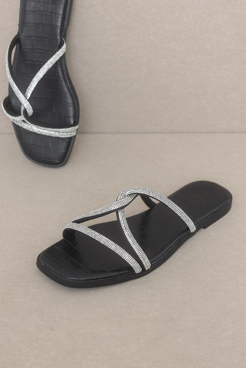 RARA Boutique strappy rhinestone sandals with thin straps and sparkling embellishments, perfect for dressy occasions.