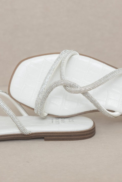 RARA Boutique strappy rhinestone sandals with thin straps and sparkling embellishments, perfect for stylish summer footwear.