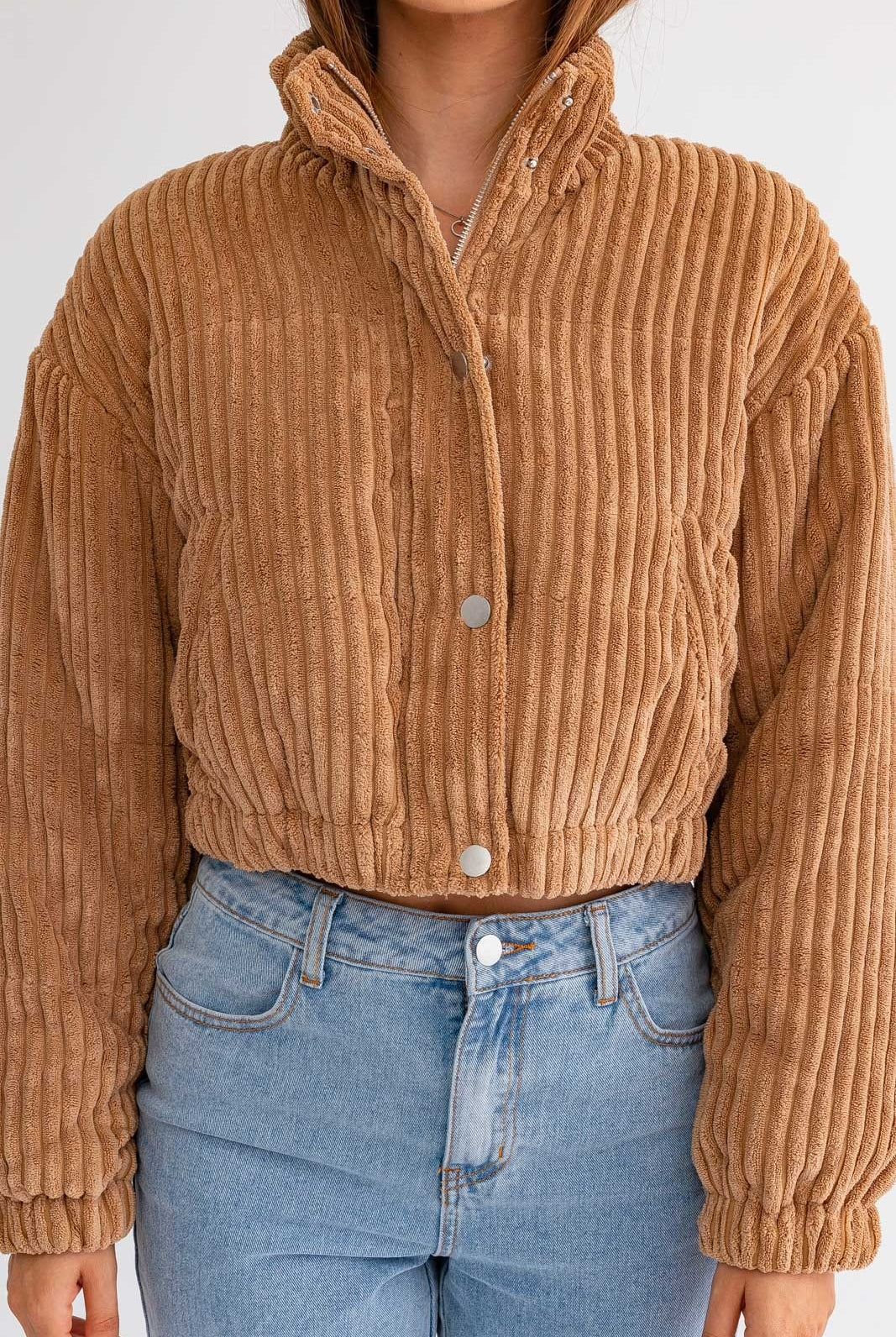 Le Lis cropped corduroy puffer jacket by RARA Boutique, shown in a stylish, fitted design with a stand-up collar and puffy texture.