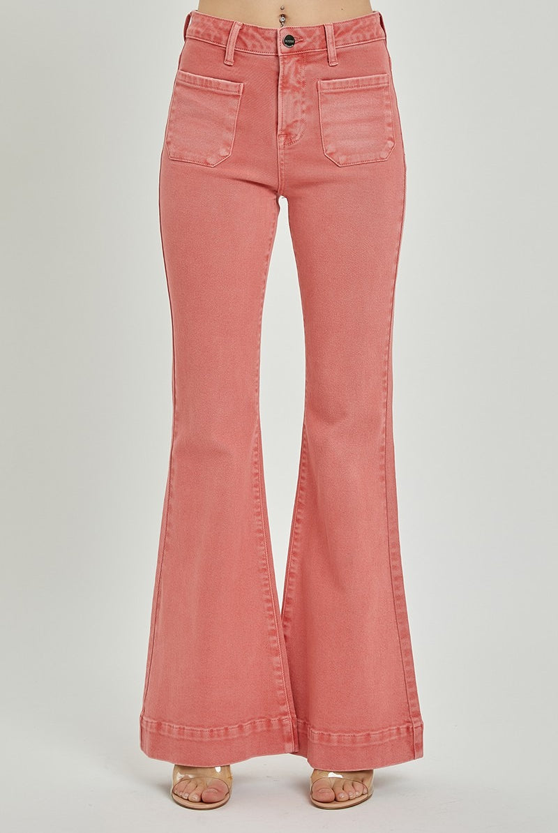 High rise patch pocket bell bottom jeans from RARA Boutique featuring distressed details and flared leg silhouette.