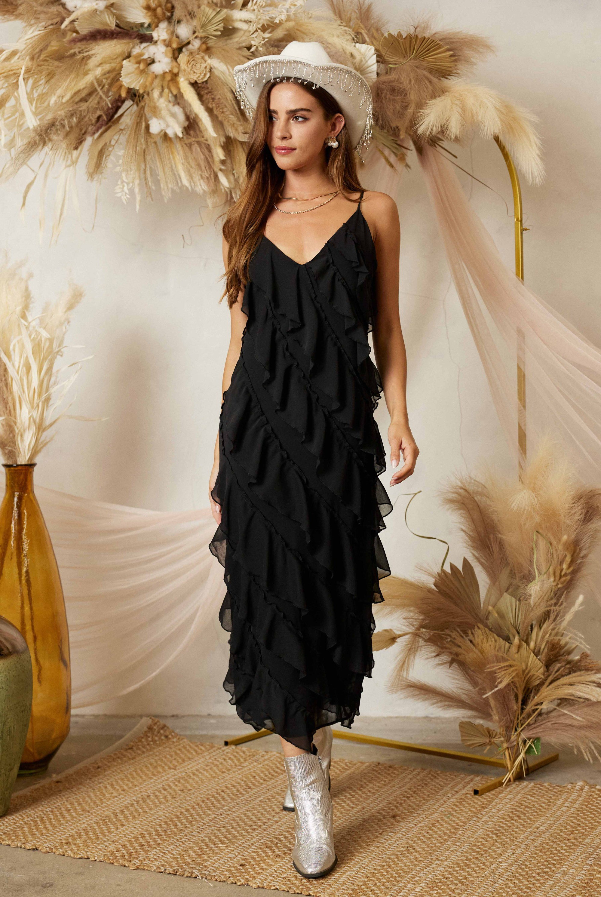 Diagonal tiered ruffle midi dress by RARA Boutique, featuring layered fabric and a stylish, flowy silhouette.