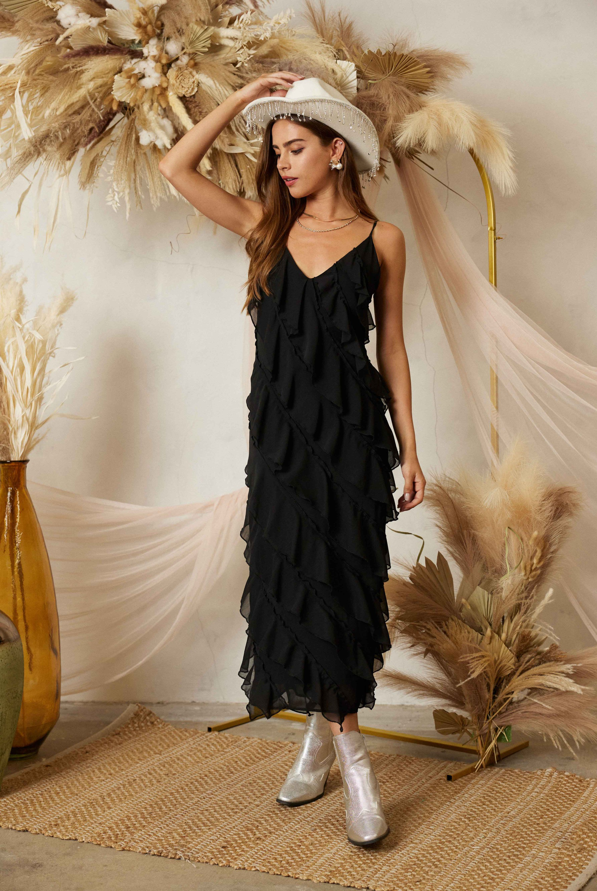 Diagonal tiered ruffle midi dress by RARA Boutique featuring layered fabric and a flowy silhouette.