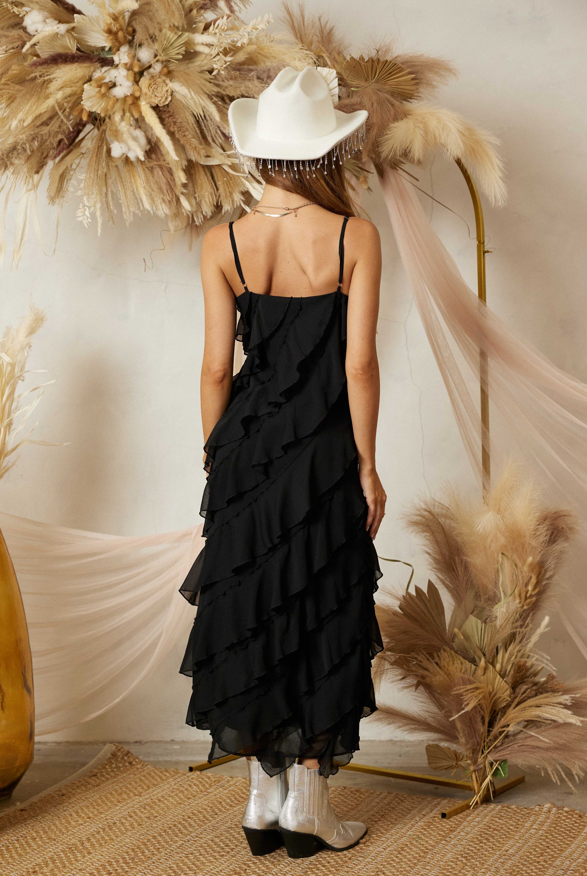 Diagonal tiered ruffle midi dress by RARA Boutique with flowing fabric and layered ruffles, perfect for elegant occasions.