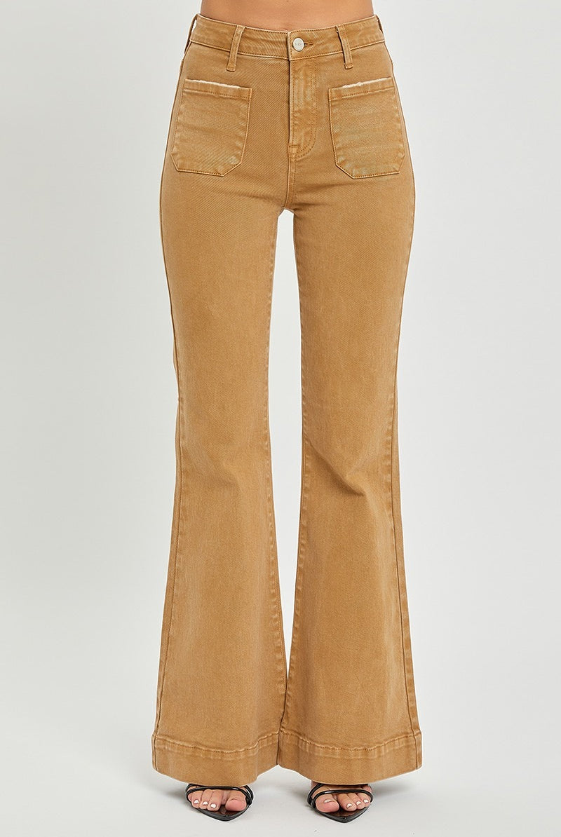 Risen high rise patch pocket bell bottom jeans in light denim with distressed details and flared leg design.