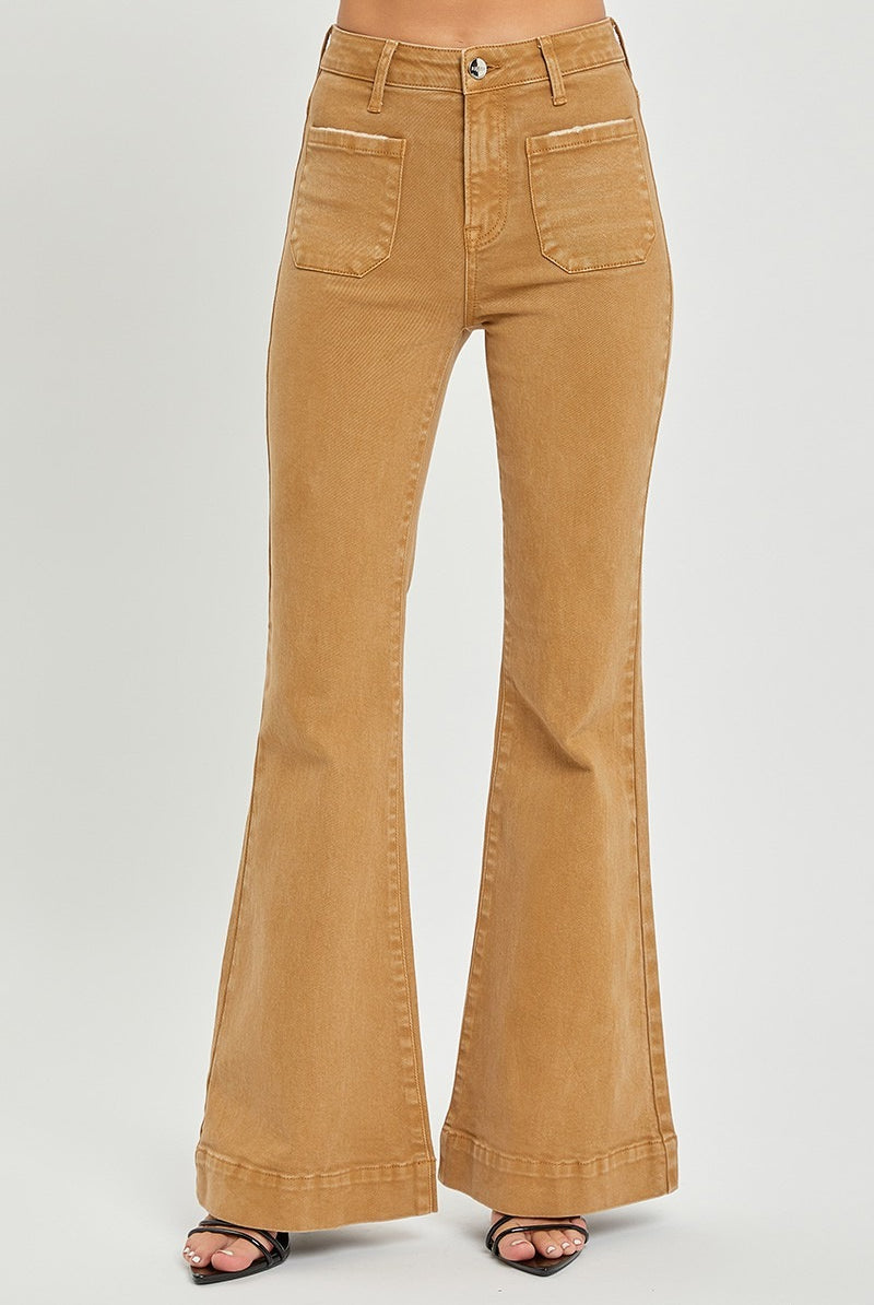 Risen high rise patch pocket bell bottom jeans with distressed details and flared legs, stylish denim pants for a retro look.