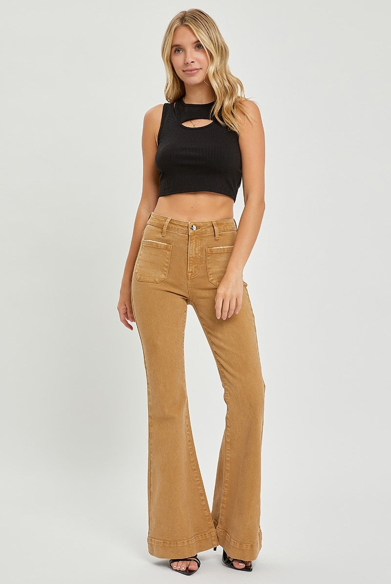 Risen high rise patch pocket bell bottom jeans in denim, showcasing the flared leg and classic five-pocket design.