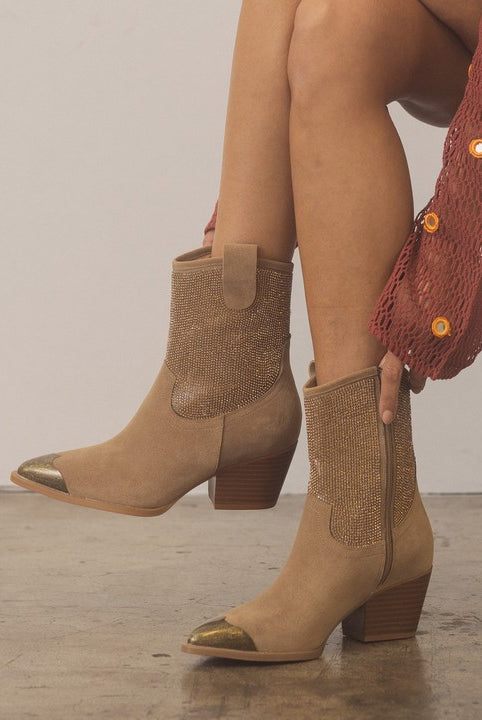 Rara Boutique rhinestone studded Western booties with metal toe, black leather, decorative stitching, and Western-inspired design.