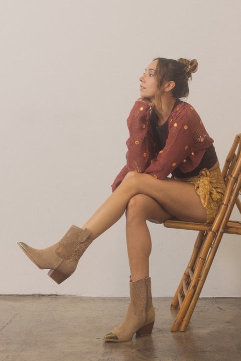 Rhinestone studded western booties with metal toe from RARA Boutique, featuring a stylish design and pointed toe detail.