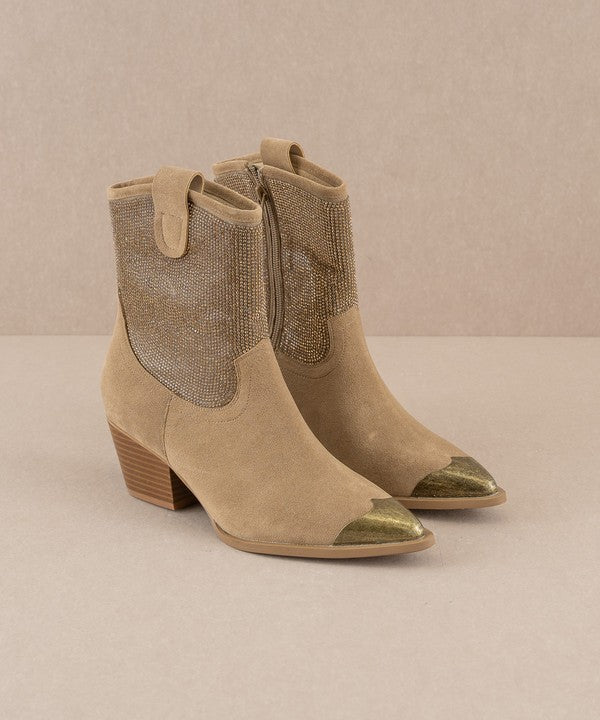 Rhinestone studded western booties with metal toe by RARA Boutique featuring intricate rhinestone details and western style design.
