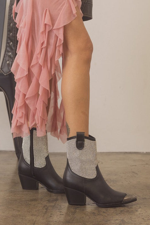 Rhinestone studded western booties with metal toe from RARA Boutique featuring intricate embellishments and a stylish Western design.