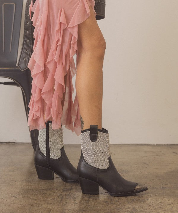 Rhinestone studded western booties with metal toe from RARA Boutique featuring intricate embellishments and a stylish Western design.