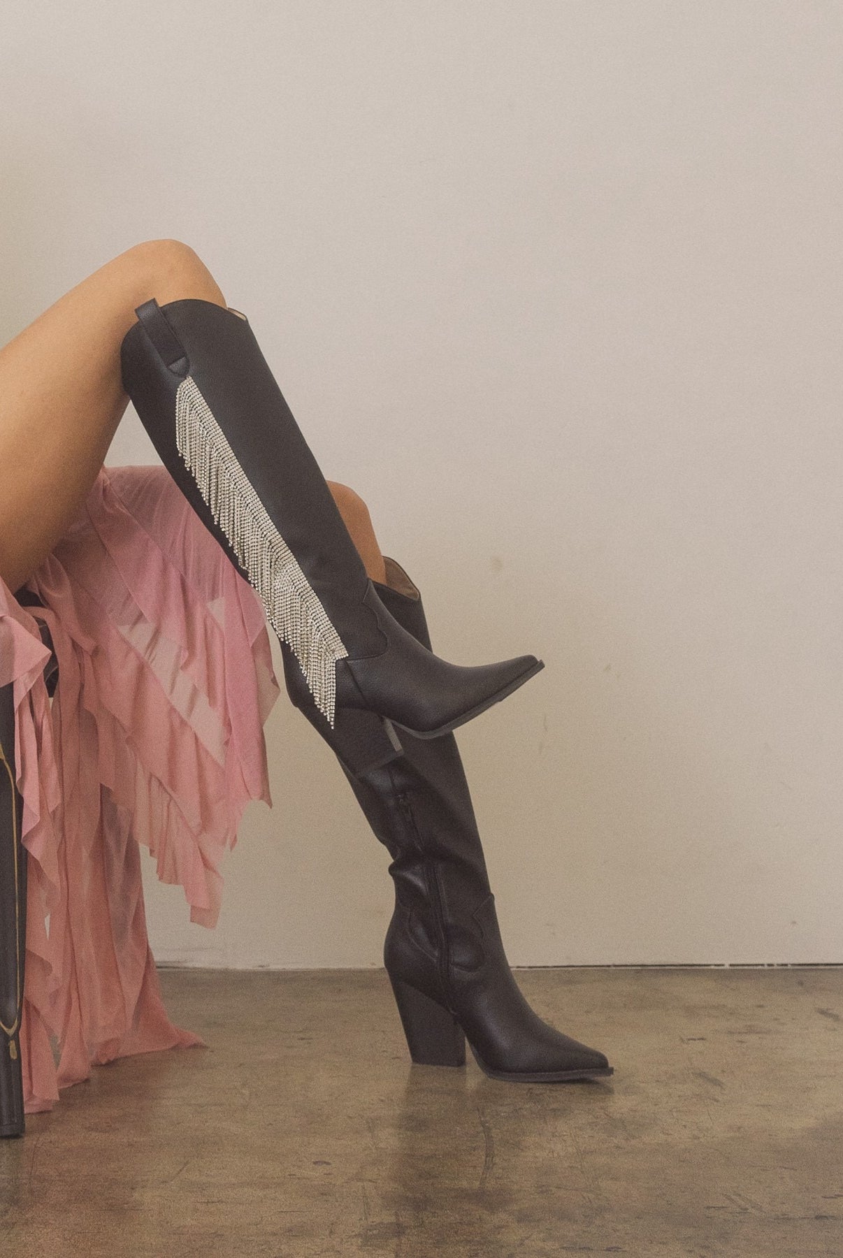 Rhinestone fringe knee-high Western boots by RARA Boutique with sparkling rhinestones and Western-style design.