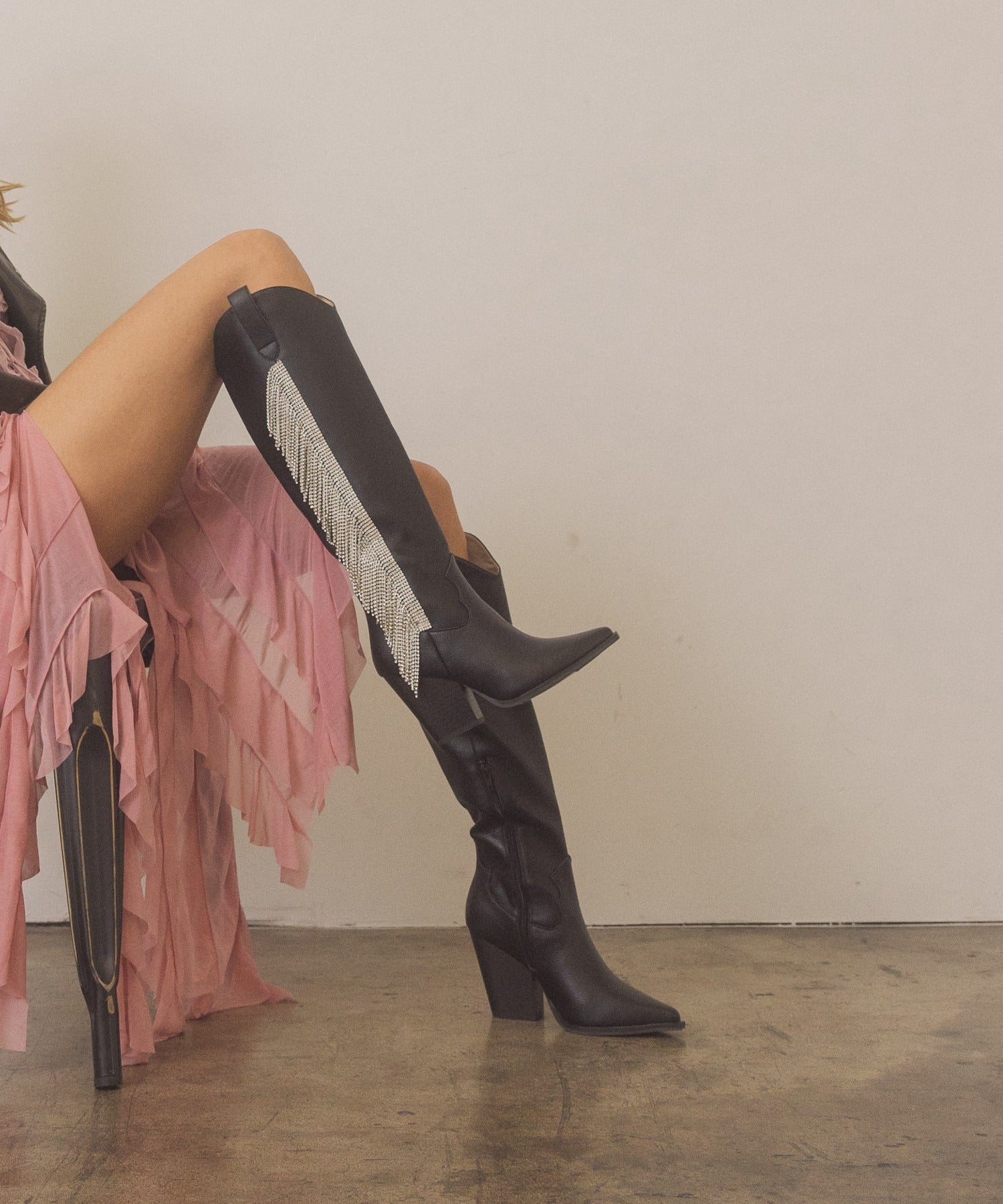 Rhinestone fringe knee-high Western boots by RARA Boutique with sparkling rhinestones and Western-style design.