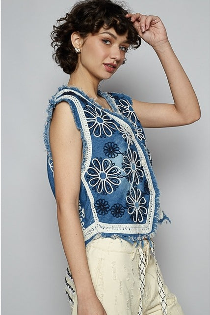 Crochet floral V-neck denim vest by RARA Boutique featuring intricate floral crochet patterns and a stylish V-neck design.