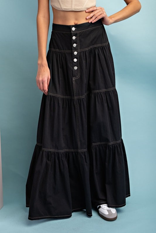 RARA Boutique A-Line Tiered Button-Up Maxi Skirt in flowing fabric with tiered design and front button closure.