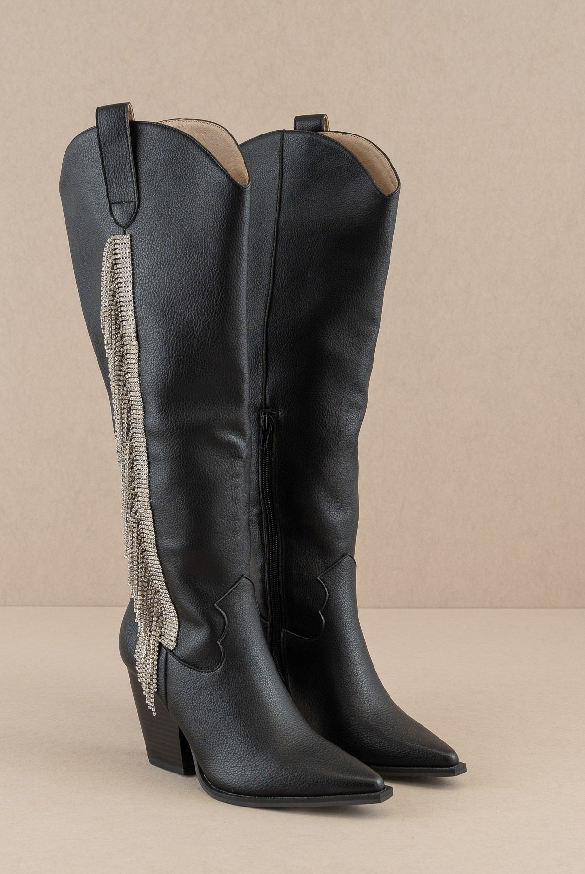 Rhinestone fringe knee-high Western boots by RARA Boutique featuring intricate detailing and a stylish Western design.