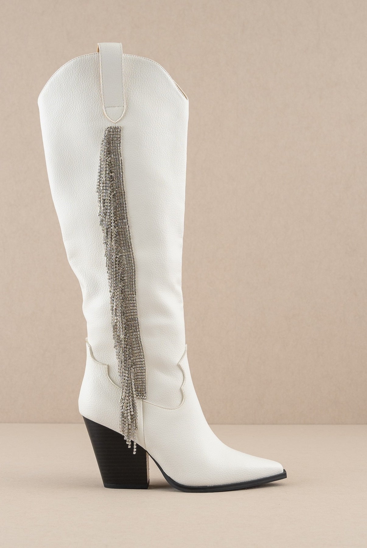 Rara Boutique rhinestone fringe knee-high Western boots with intricate detailing and Western style, perfect for fashionable wear.
