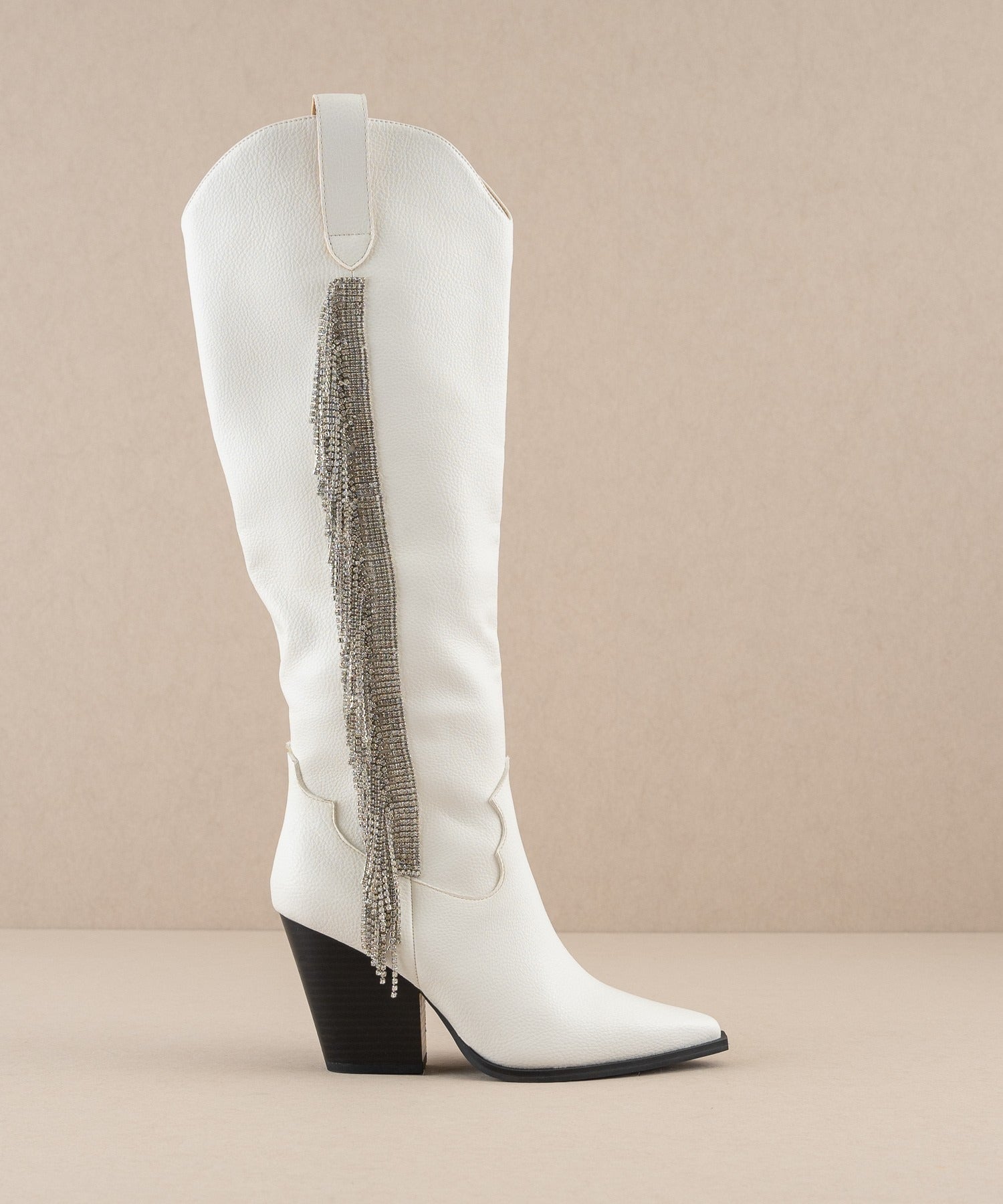 Rara Boutique rhinestone fringe knee-high Western boots with intricate detailing and Western style, perfect for fashionable wear.