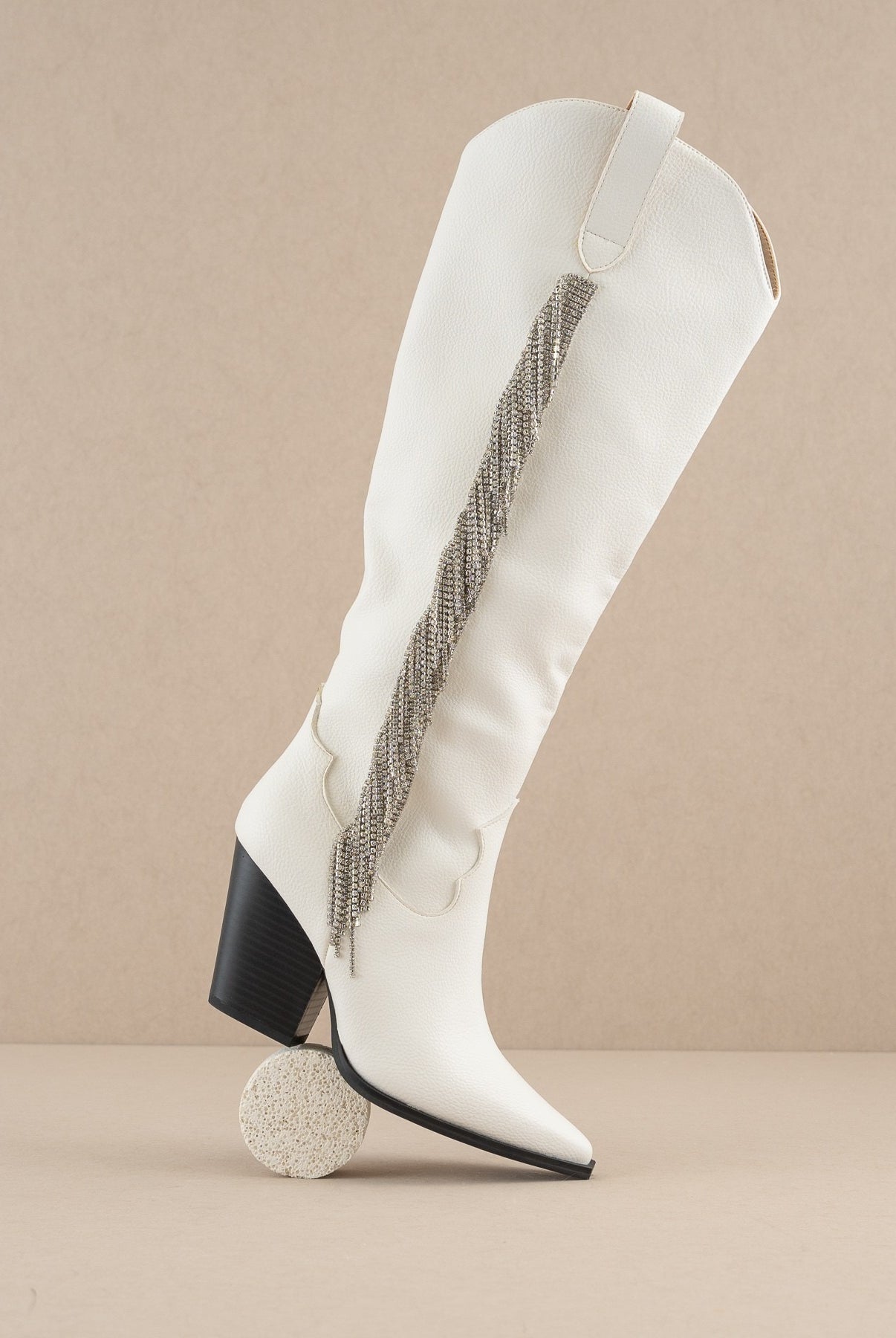 Rhinestone fringe knee-high Western boots by RARA Boutique featuring sparkling rhinestones and Western style details.