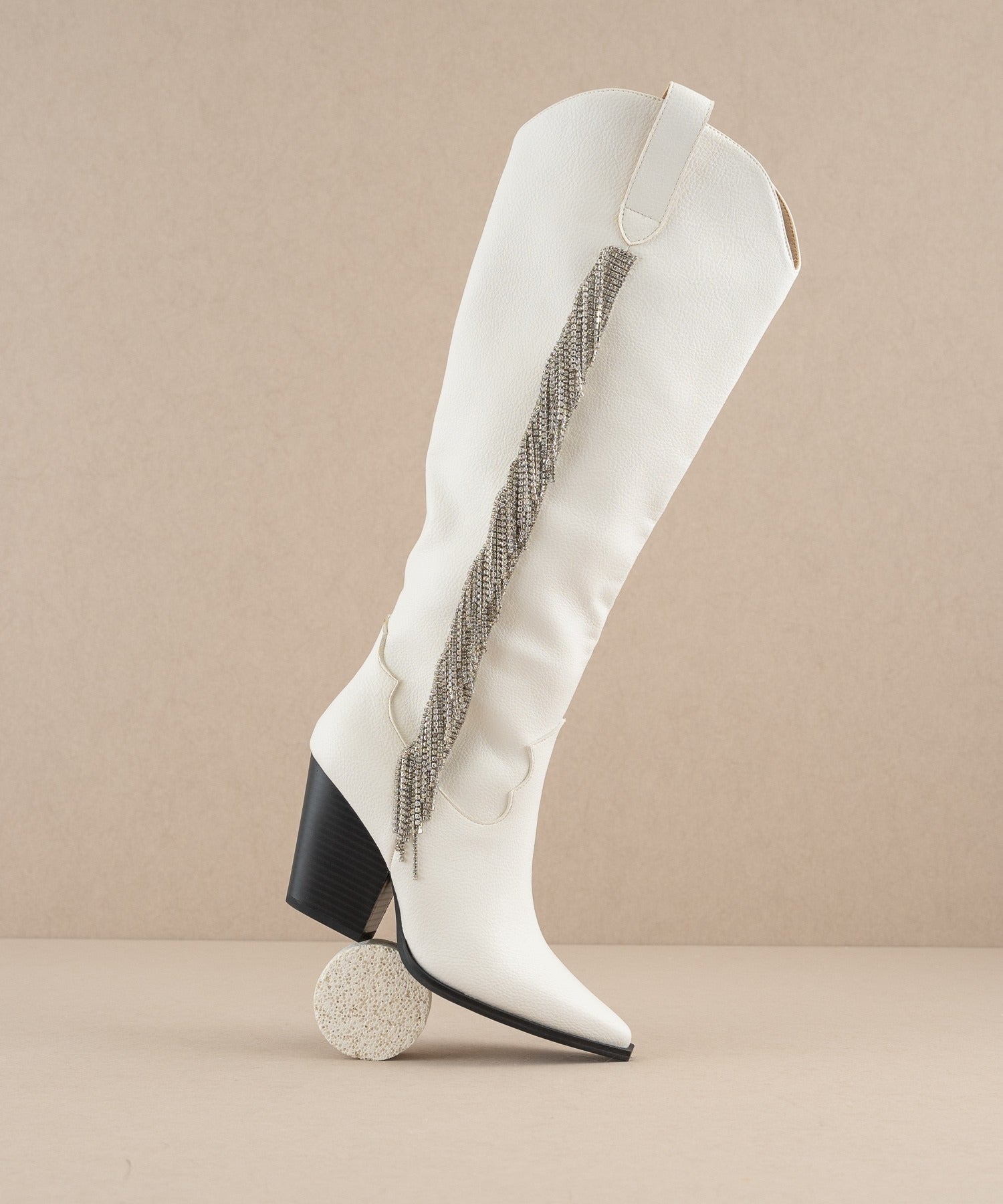 Rhinestone fringe knee-high Western boots by RARA Boutique featuring sparkling rhinestones and Western style details.