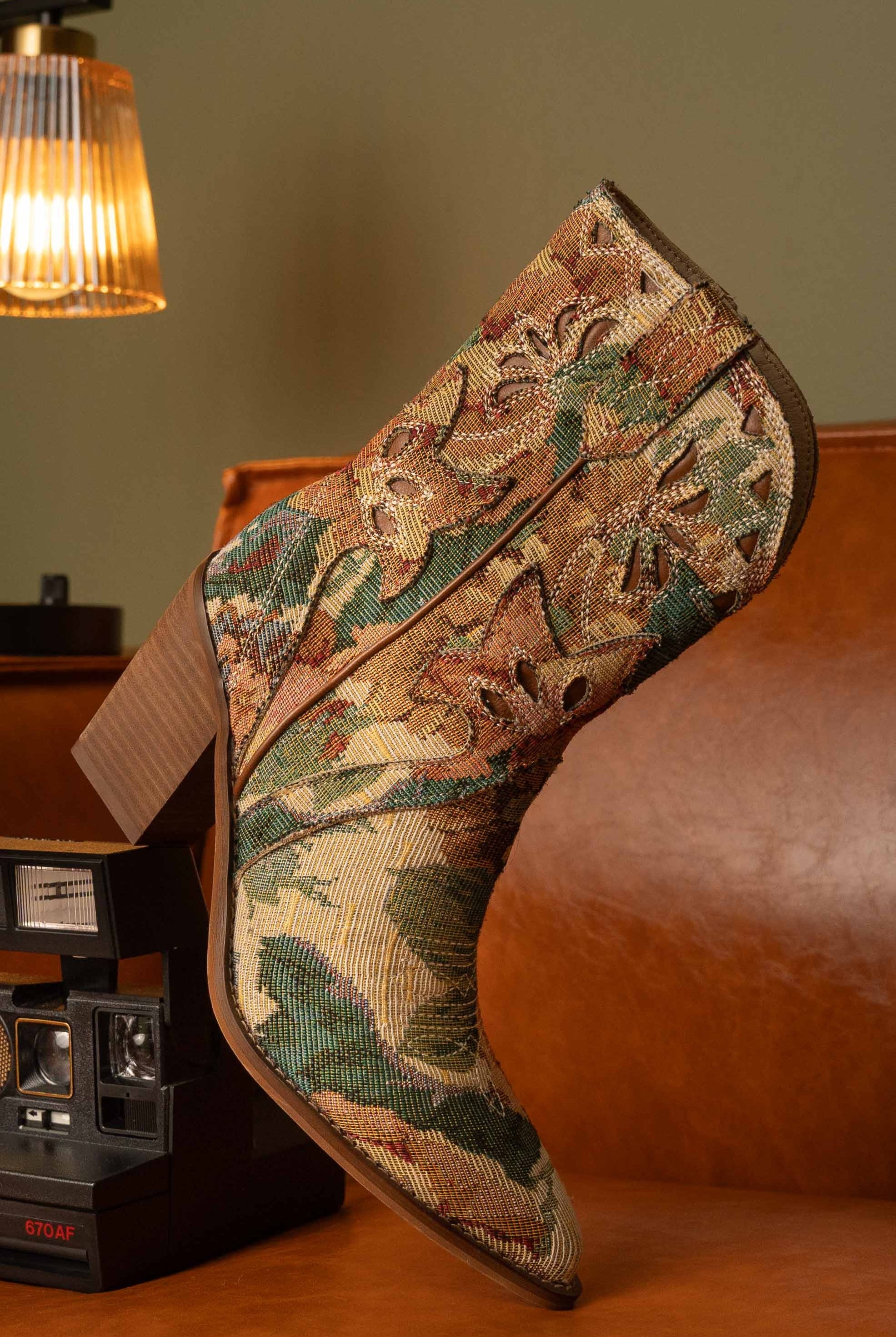 RARA Boutique floral jacquard tapestry western boots with paneled design and intricate floral patterns.