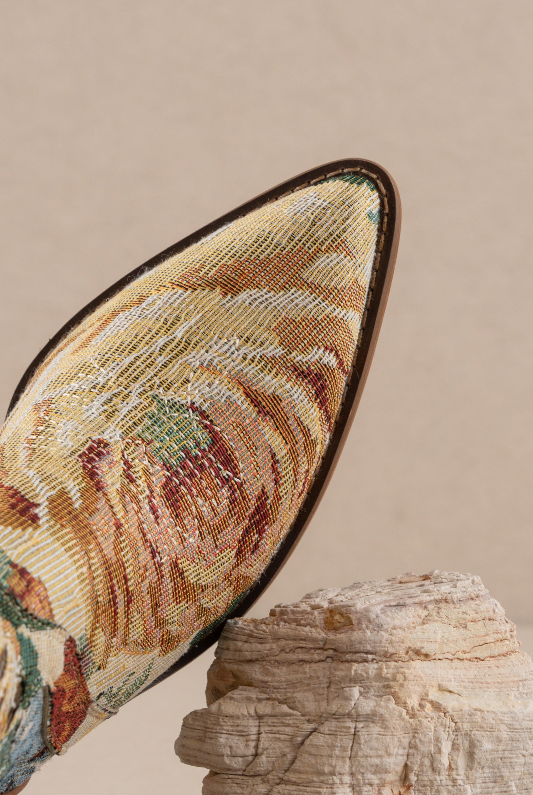 RARA Boutique floral jacquard tapestry western boot with paneled design, intricate floral pattern, and pointed toe.