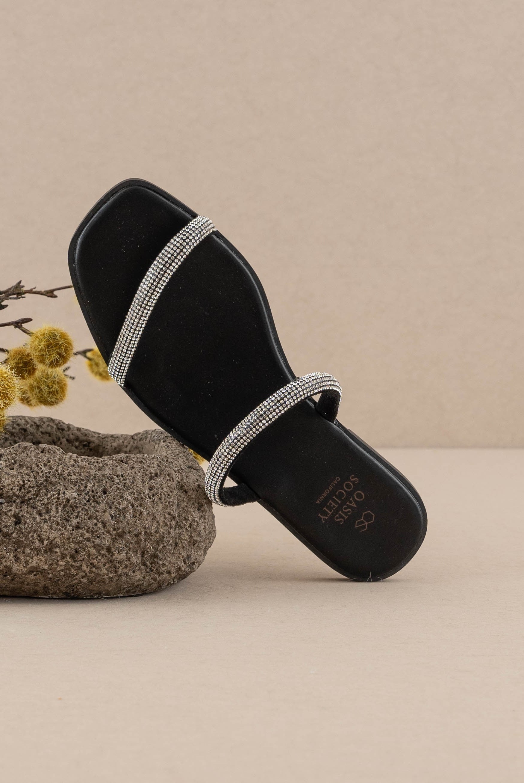 Rhinestone strappy flat slide sandals from RARA Boutique featuring sparkly rhinestone embellishments and multiple thin straps.
