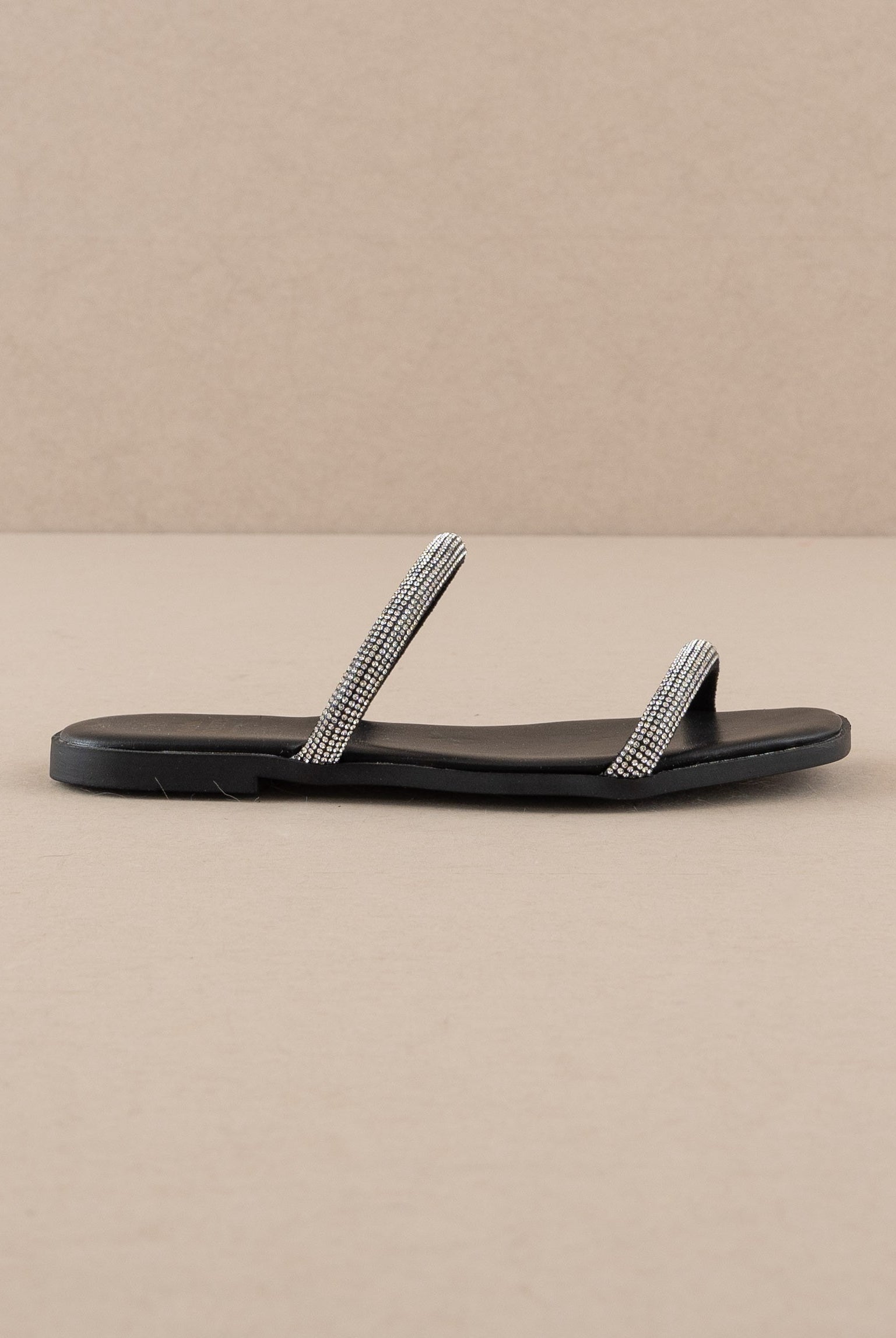 Rhinestone strappy flat slide sandals by RARA Boutique with sparkling embellishments and minimalist design.