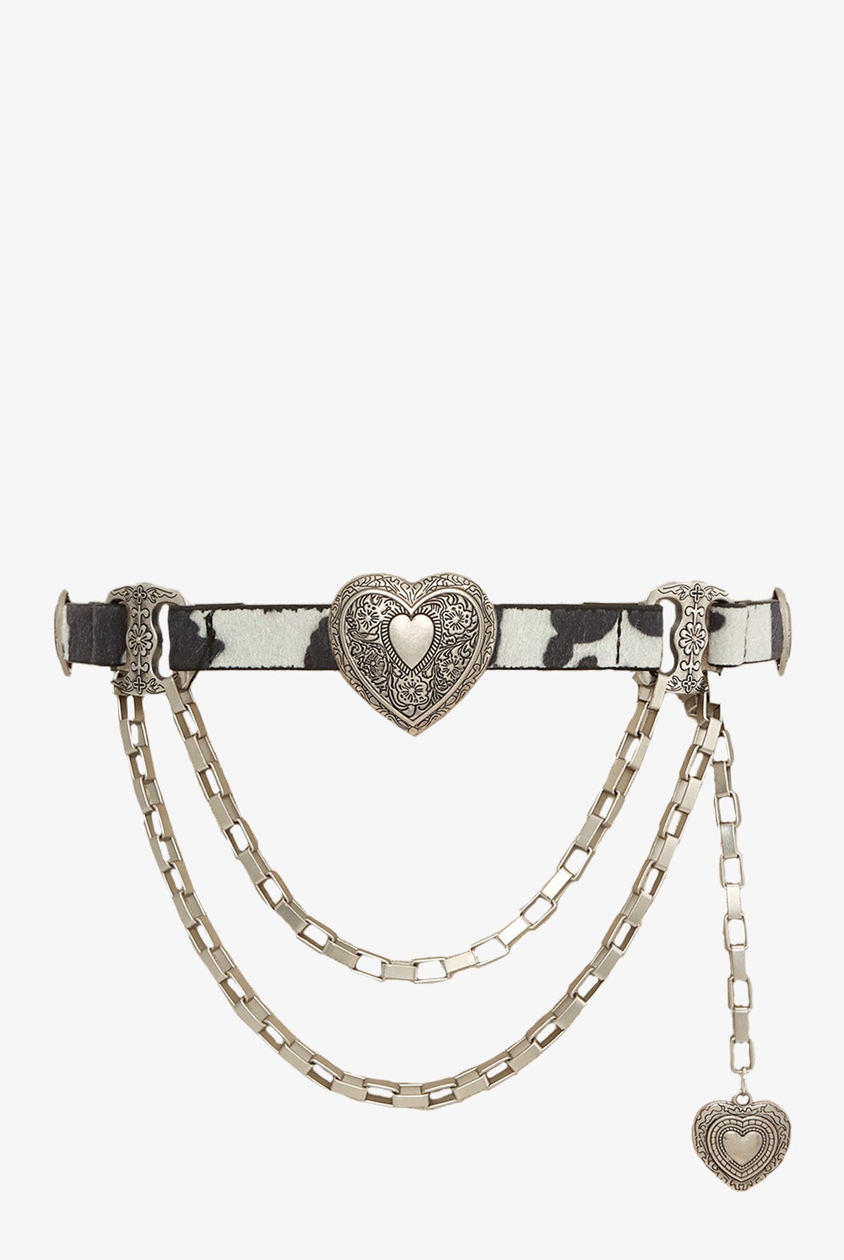 Western cowhide chain belt with engraved heart concho detail from RARA Boutique, showing the belt's leather and metal decorative elements.